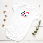 White custom-logo baby bodysuit with a red and navy sample business logo and “Your logo” lettering.