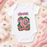 White personalised 10 months old baby bodysuit with pink numbers, a koala, green leaves and flowers.