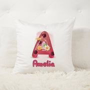 White pillow with a decorative letter 'A' and name 'Amelia' on a white background