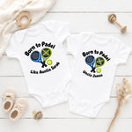 White personalised padel bodysuit and T-shirt with crossed rackets and custom auntie and uncle messages.
