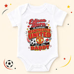 White personalised Edison Manchester United baby bodysuit with red and gold lettering, club crest and football.