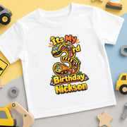 White personalised Nickson third birthday T-shirt with a large number 3, construction trucks and yellow lettering.