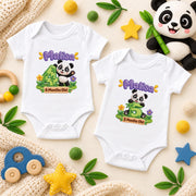 Two white personalised panda milestone bodysuits showing green numbers 4 and 5 with colourful nursery props.