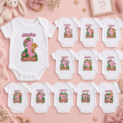 Personalised pink safari milestone bodysuit set for months 1–12 with animal illustrations, green leaves and flowers.