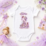 White personalised 1 month old fairy princess baby bodysuit with purple flowers, a castle toy and fairy doll.